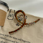 Model wearing Beau large size acetate claw clip in brown hair from side angle