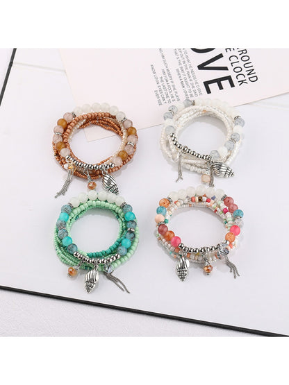 Lovra alloy pendant beaded bracelet with silver beads and a round alloy charm on a white background