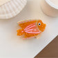 Top view of Beau colorful fish claw clip showing the clasp mechanism
