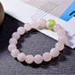 Lovra pink crystal beaded bracelet displayed on a wooden surface with soft lighting