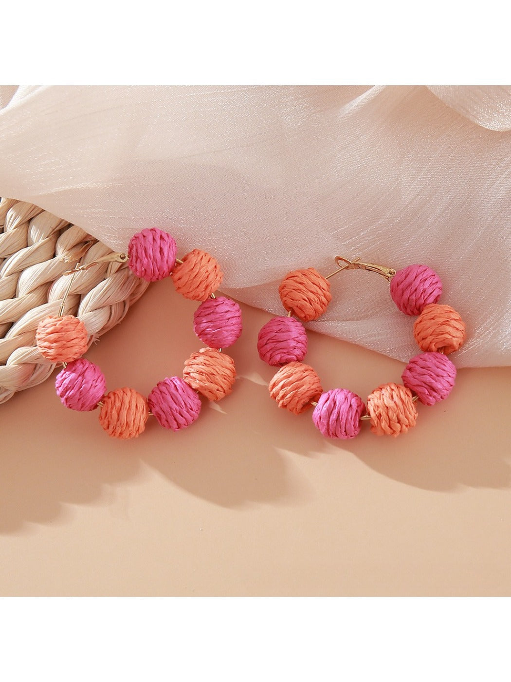 Earedge vintage raffia earrings with gold-tone hooks close-up detail
