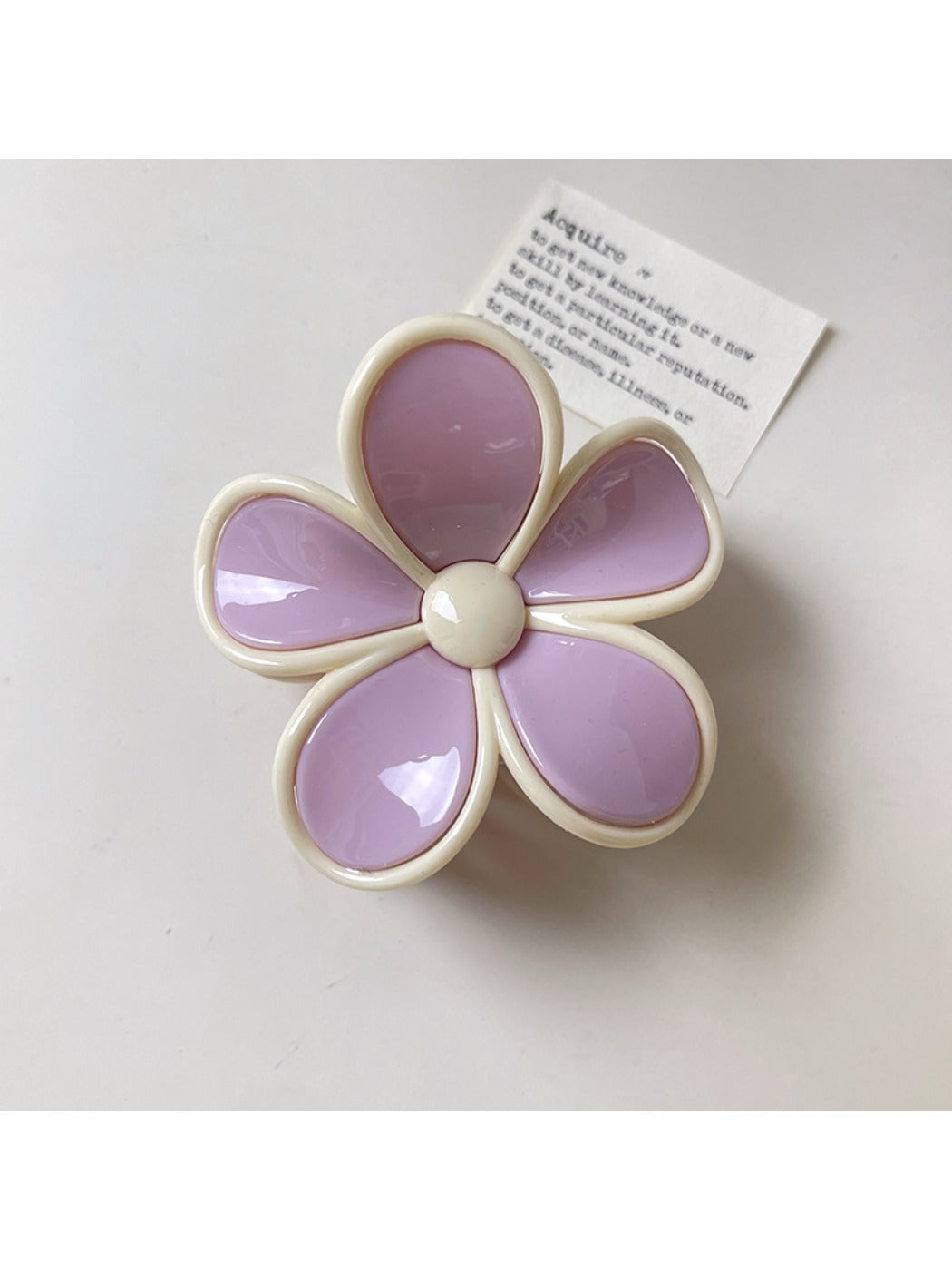 Beau flower claw clip positioned to show both top flower design and side clasp