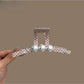 Beau pink hair clip with white polka dots, rectangular shape, glossy finish