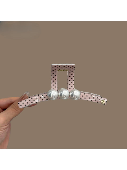Beau pink hair clip with white polka dots, rectangular shape, glossy finish