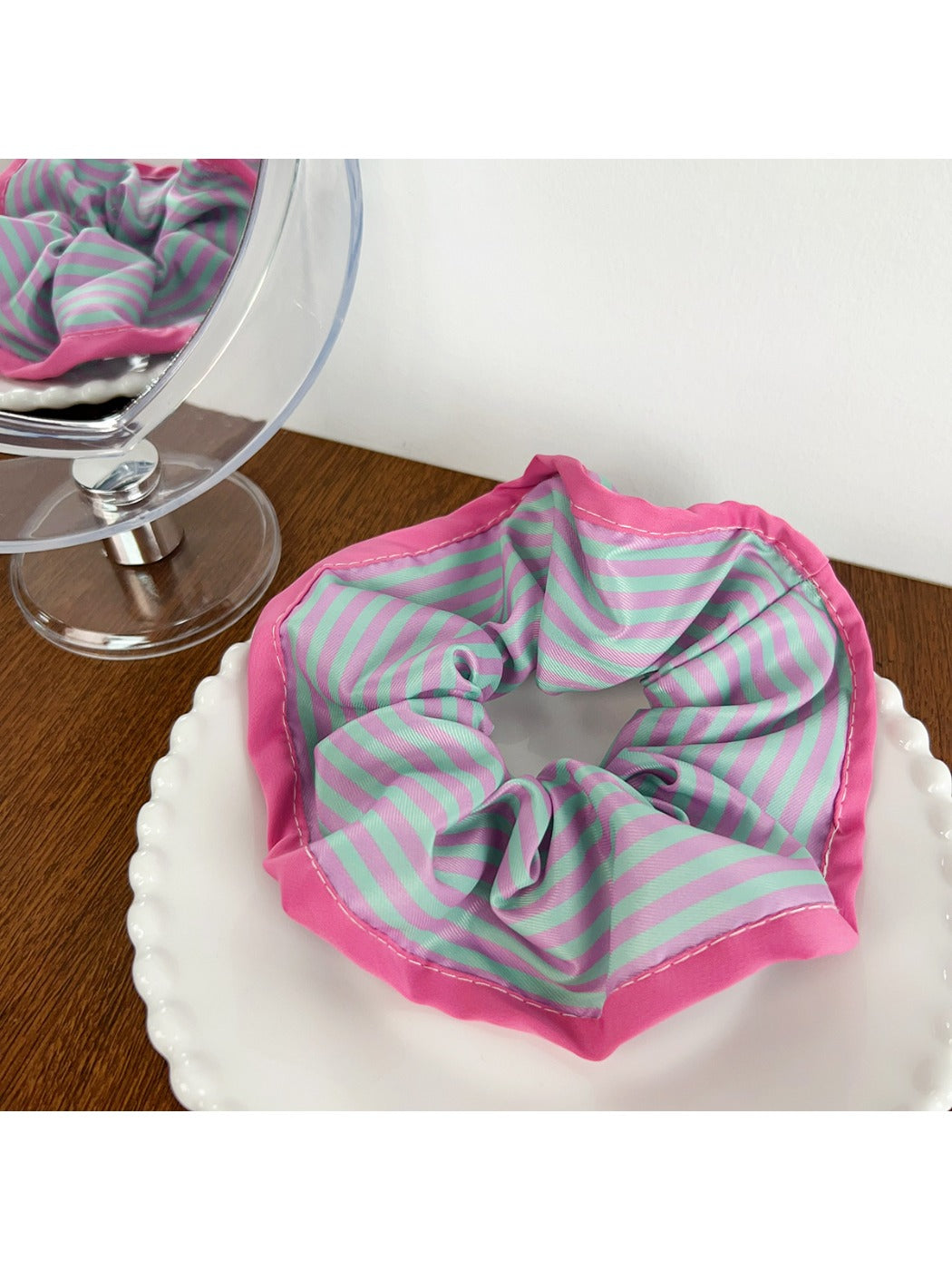 Top view of magenta color block scrunchie with visible stitching