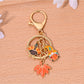 Orange alloy keychain displayed on a white background emphasizing its vibrant color