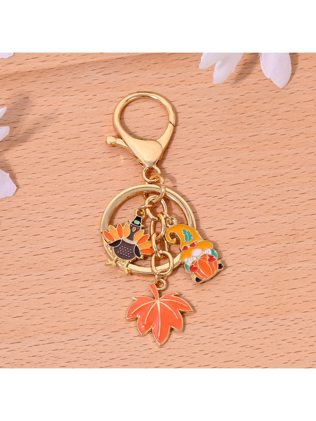 Orange alloy keychain displayed on a white background emphasizing its vibrant color