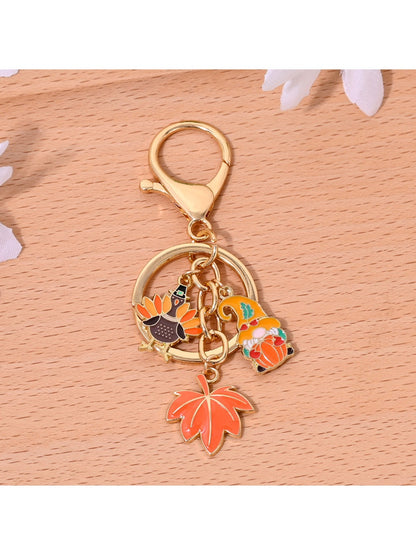 Orange alloy keychain displayed on a white background emphasizing its vibrant color