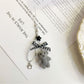 Keypus bear bag charm keychain photographed against a pastel background
