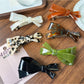 Close-up of Beau elegant bow hair clip highlighting acetate material and clasp