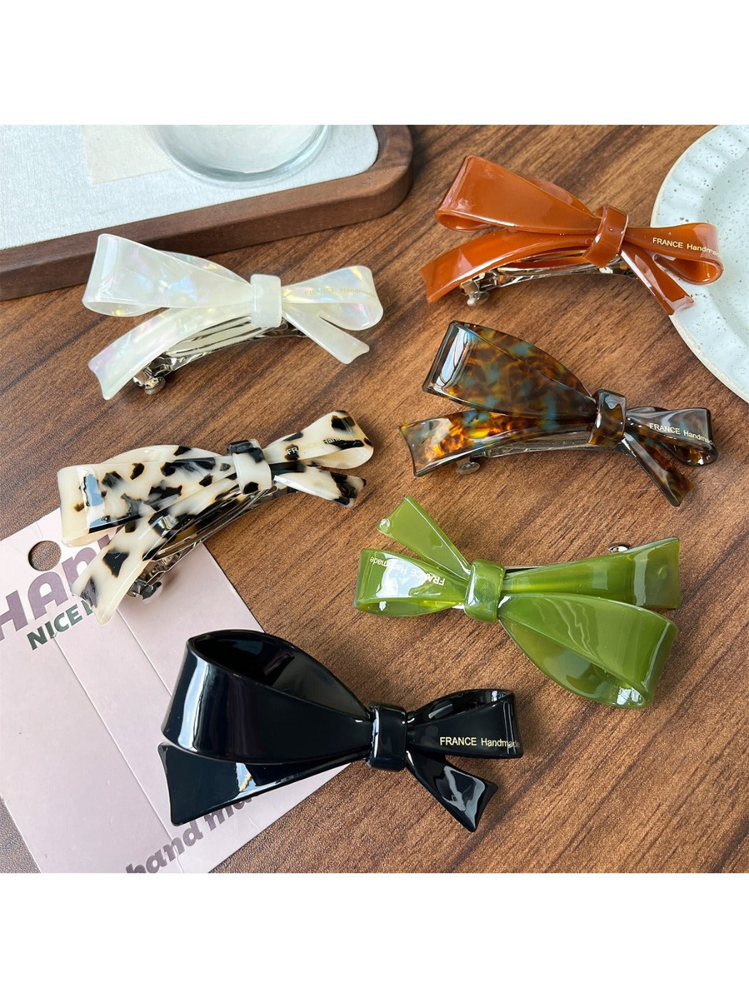 Close-up of Beau elegant bow hair clip highlighting acetate material and clasp