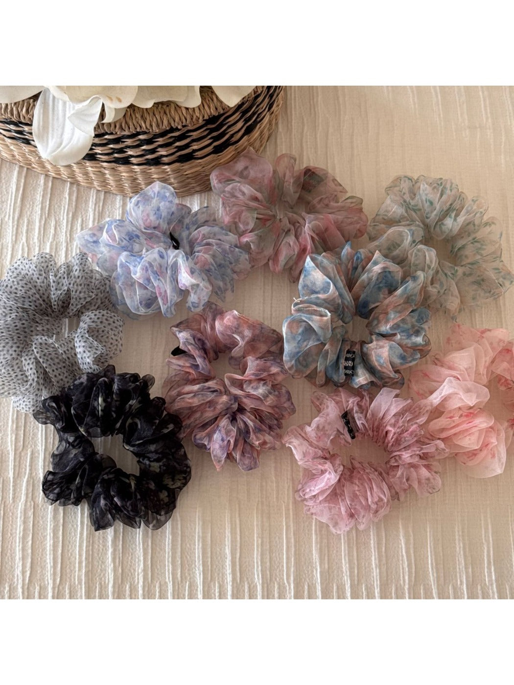 Scrunchie wrapped around a ponytail with colorful flowers