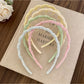 Gifty wavy headband displayed on a white background showing its texture