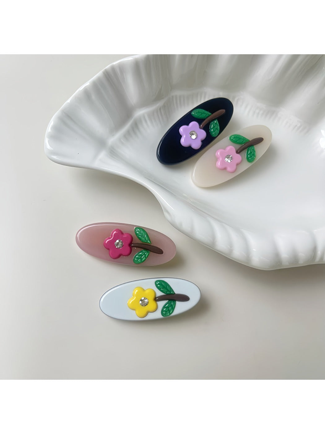 Close-up of Beau oval hair clip showing smooth curved edges and clasp mechanism