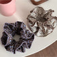 Gifty Retro Lace Floral Scrunchie displayed on a white background showing full circular shape