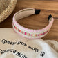 Side view of Gifty vintage wide edge woven headband highlighting its wide edge design and fabric weave