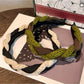 Model wearing vintage knitted twist headband styled with casual outfit