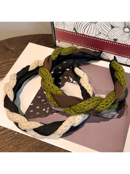 Model wearing vintage knitted twist headband styled with casual outfit