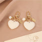 Keychain showing both heart and round ball charms hanging from a circular keyring