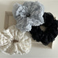 Side view of Gifty Sweet Cutout Lace Scrunchie highlighting the elastic band and lace design