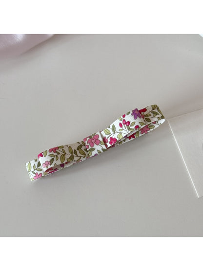 Beau Sweet Floral Print Hair Clip placed on a white surface with natural lighting