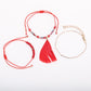 Lovra small bead bracelet with feather pendant displayed on white background