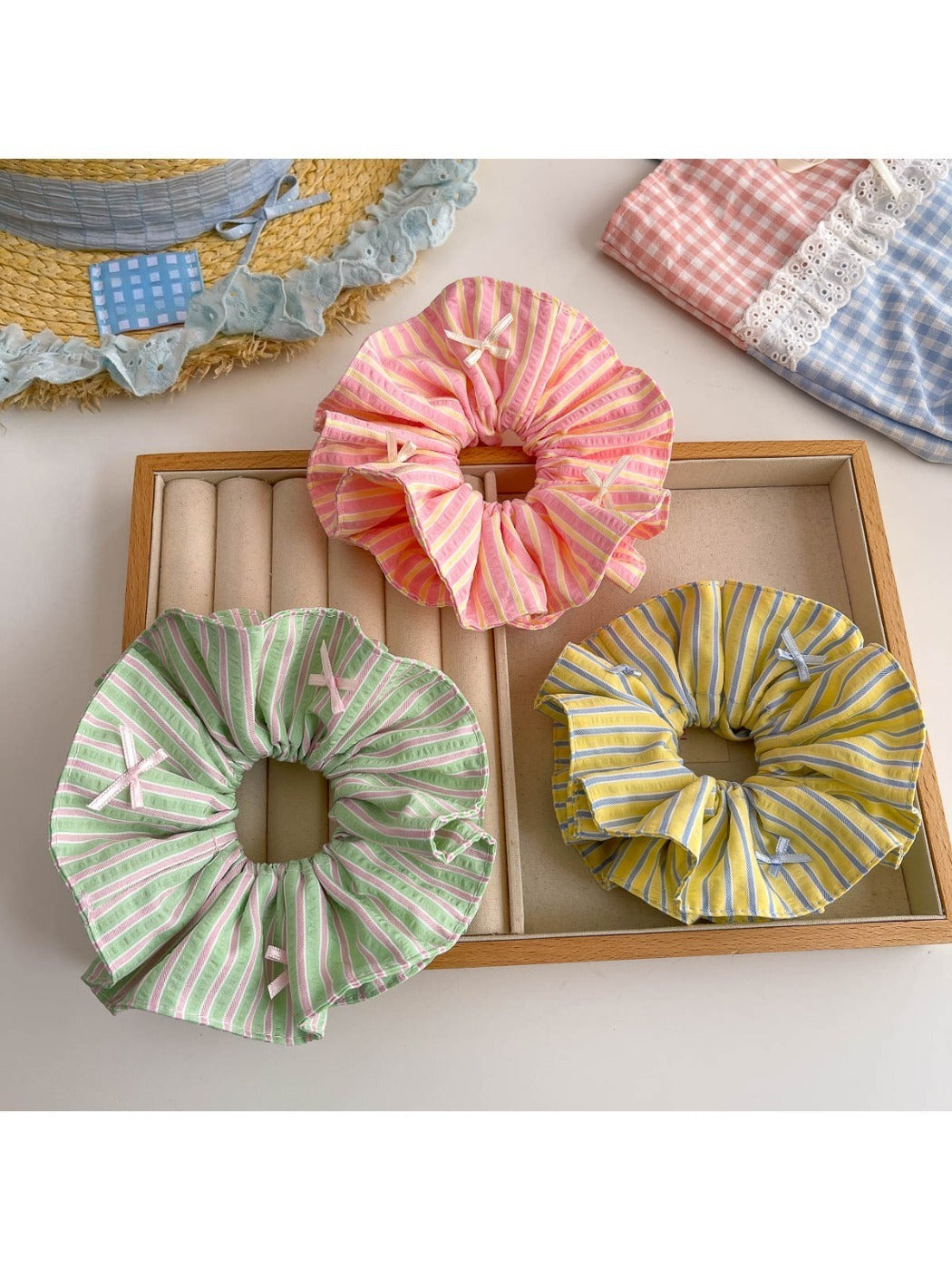 Gifty scrunchie with color block stripe print on a white background