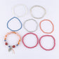 Lovra stackable beaded bracelets arranged in a circle showing different bead styles and colors
