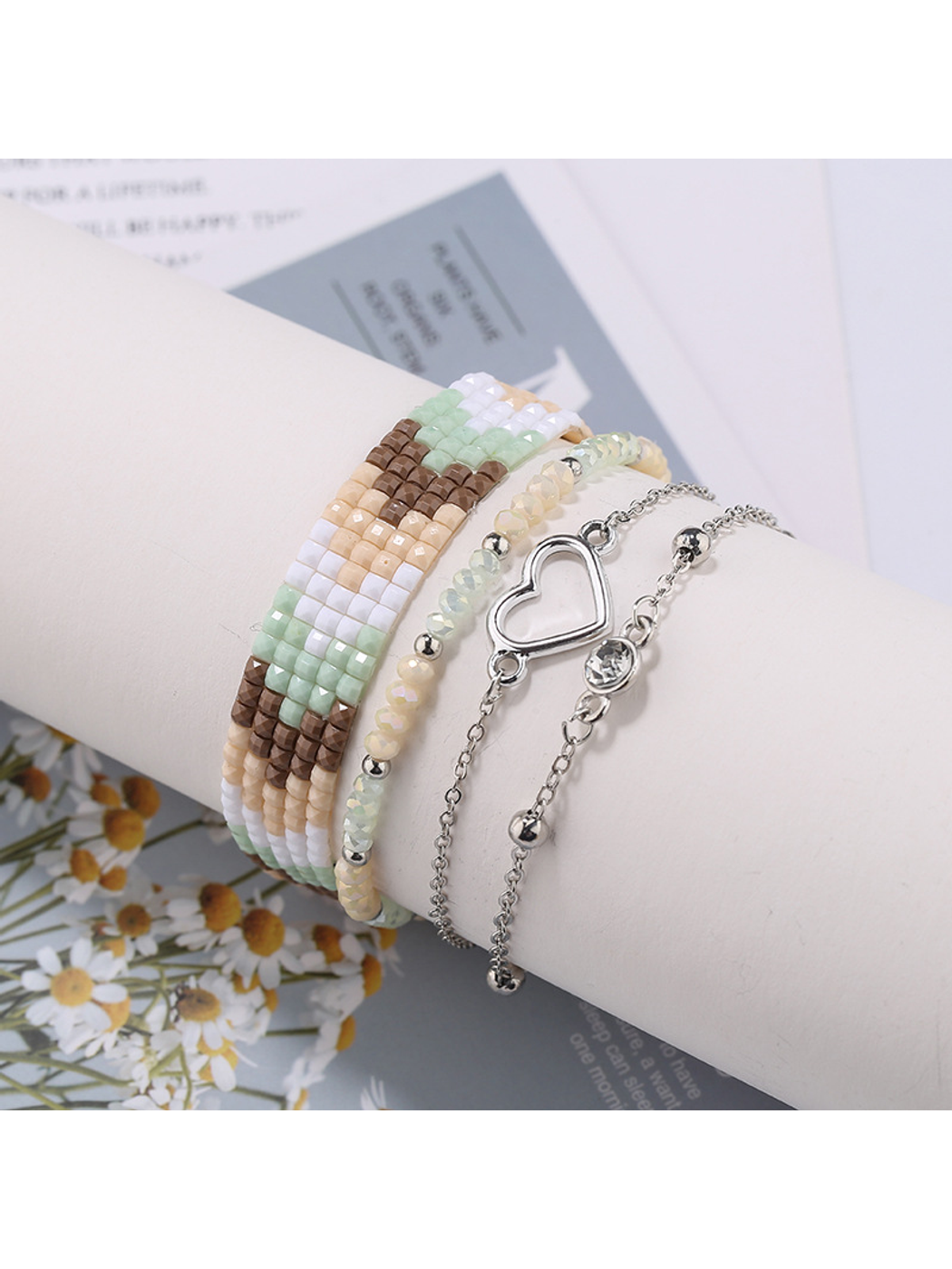 Multiple Lovra boho stackable beaded bracelets layered on a model's arm