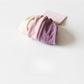 Hair ties bundled together with a simple paper band packaging
