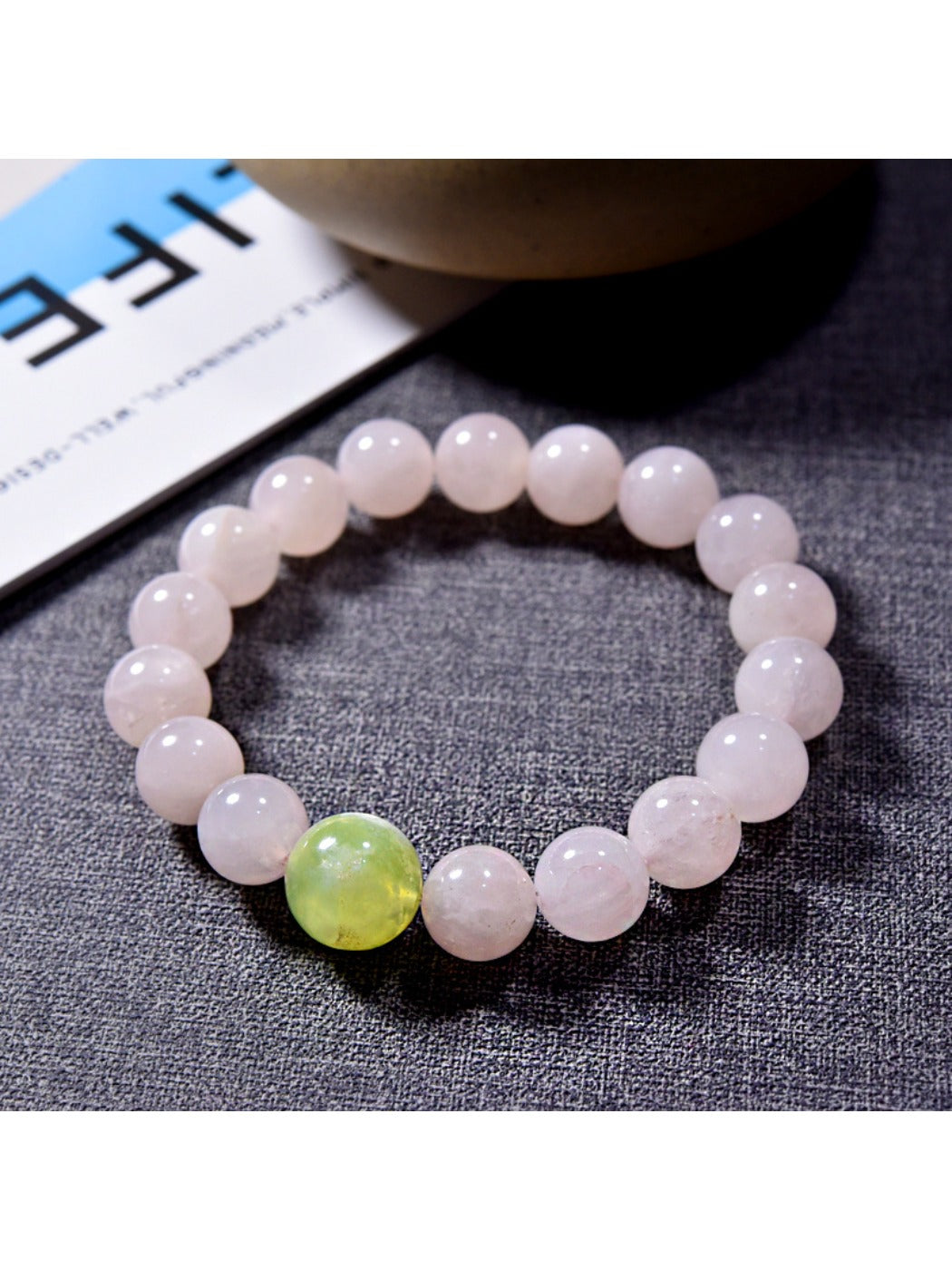 Lovra pink crystal beaded bracelet shown alongside matching jewelry pieces on a neutral background