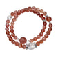 Lovra pink crystal beaded bracelet worn on wrist with natural skin tone background