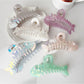 Beau fishbone shaped hair clip made of tortoiseshell acetate on white background