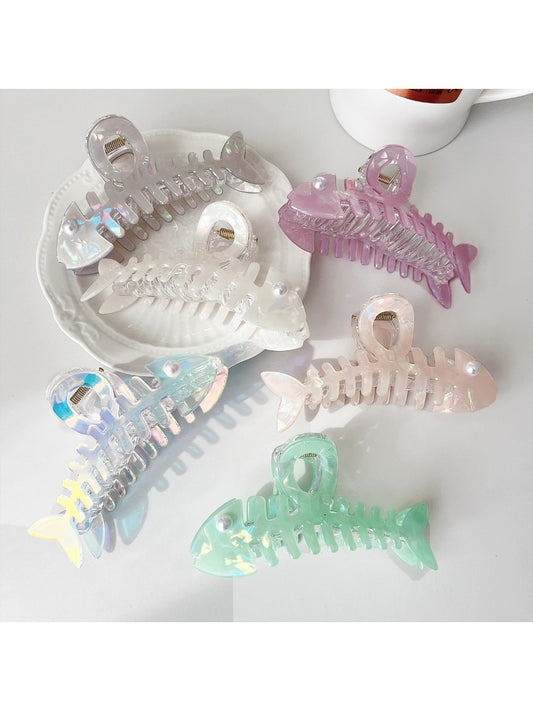 Beau fishbone shaped hair clip made of tortoiseshell acetate on white background