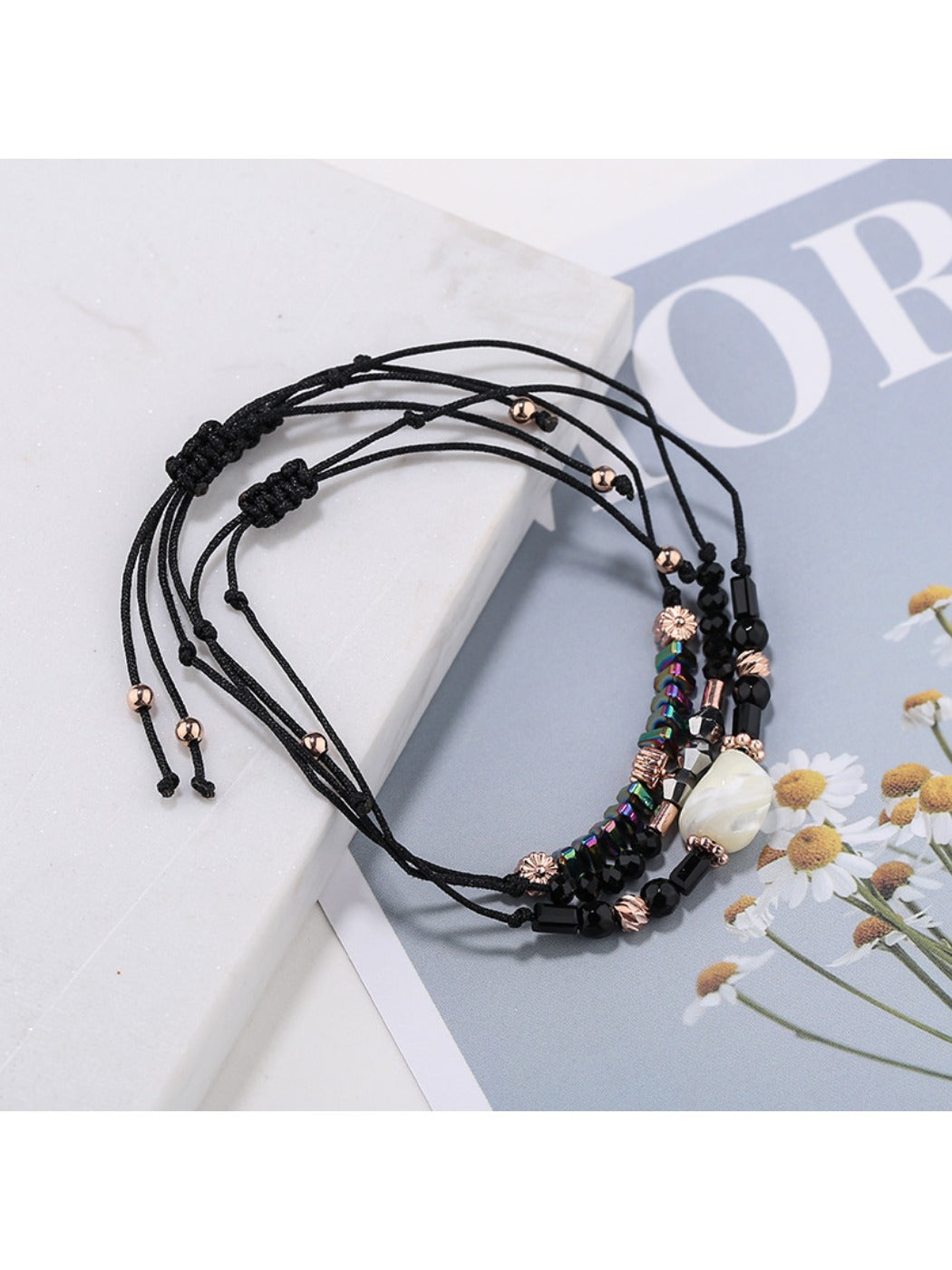 Lovra beaded woven cord bracelet coiled with visible bead colors and texture