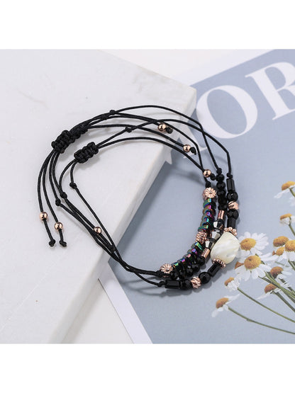 Lovra beaded woven cord bracelet coiled with visible bead colors and texture