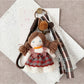 Side view of Keypus double ponytail fabric doll keychain highlighting hair and outfit