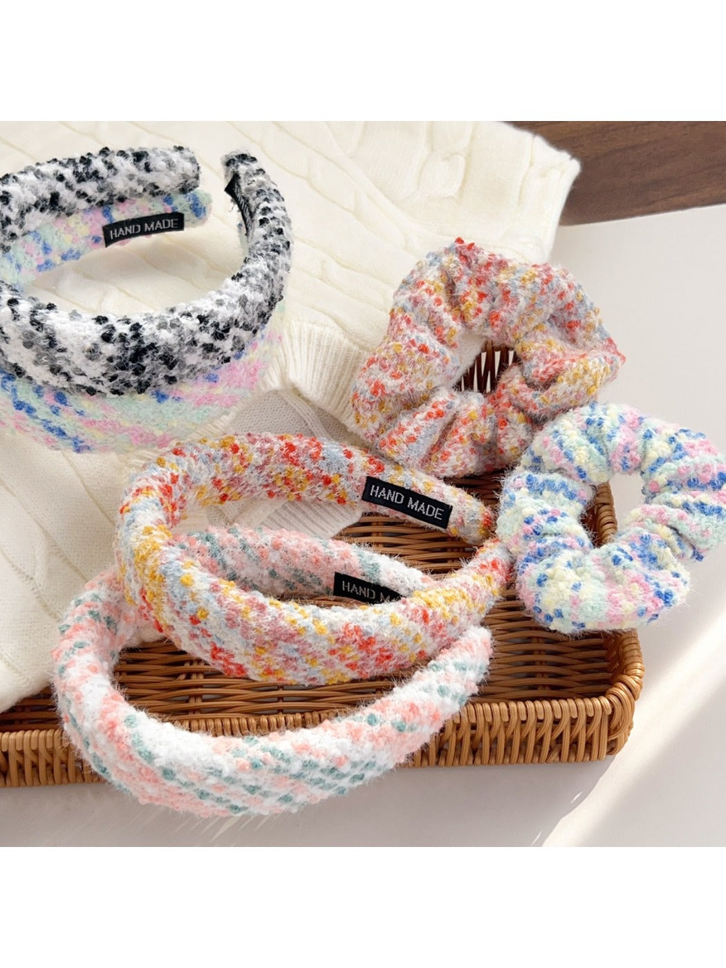 Colorful scrunchie with vibrant floral pattern on a white background