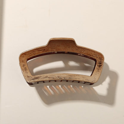 Beau - Glossy PS Curved Hollow Design Claw Clip