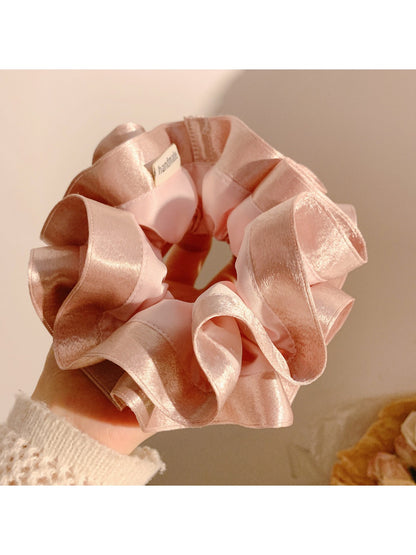 Top view of Gifty satin ruffle scrunchie showing circular shape and ruffled edges