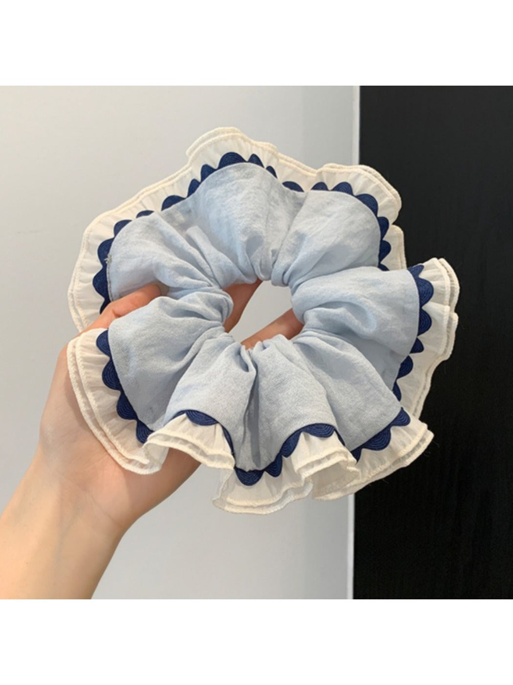 Gifty scrunchie styled on a wrist as a fashion accessory