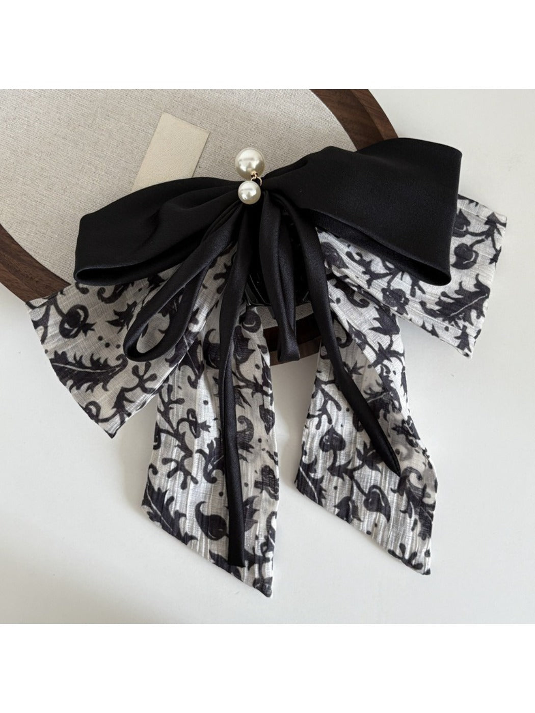 Beau Ink Wash Bow Ribbon Claw Clip attached to hair in a styled look