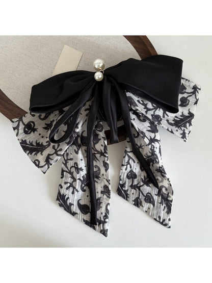 Beau Ink Wash Bow Ribbon Claw Clip attached to hair in a styled look