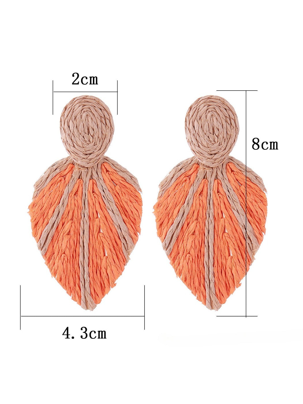 Earedge raffia woven leaf shaped earrings displayed on a wooden surface