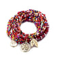 Side view of Lovra leaf pendant bracelet displaying bead colors and pendant shape