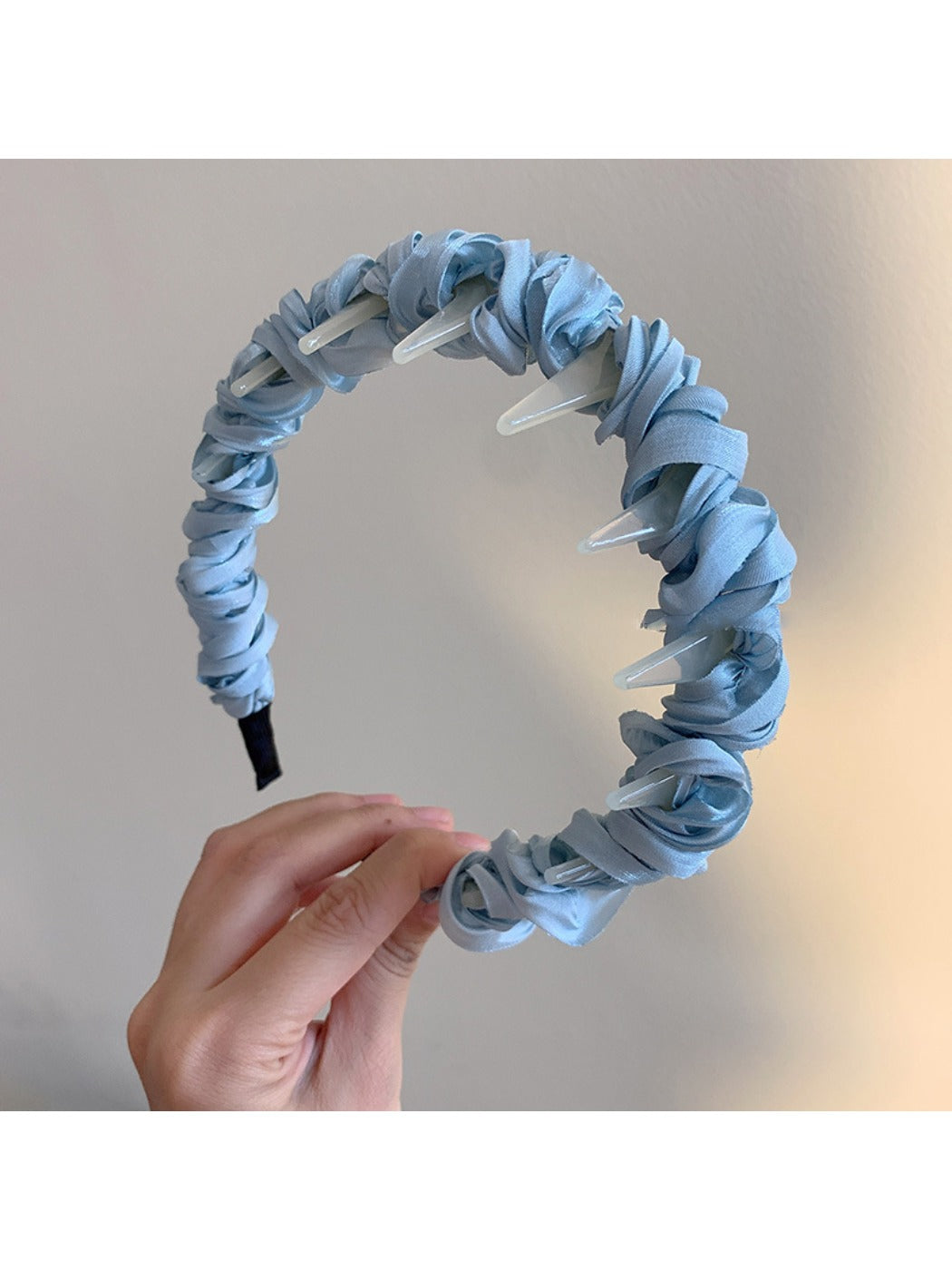 Top view of Gifty minimalist twist headband highlighting twisted design