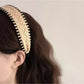 Model wearing the bohemian wide minimalist headband with loose wavy hair