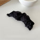Beau tulle ruffle high ponytail claw clip styled with casual outfit on model