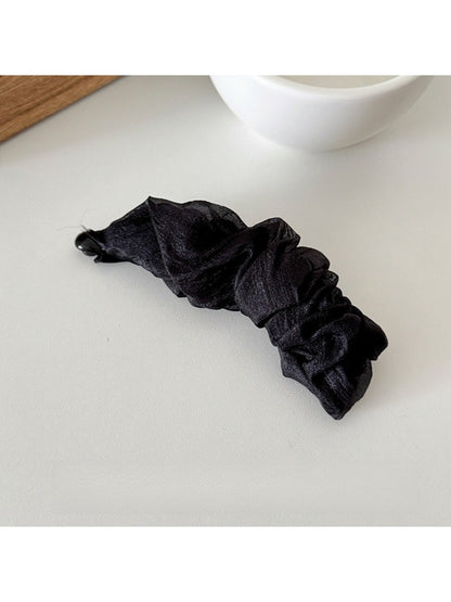 Beau tulle ruffle high ponytail claw clip styled with casual outfit on model