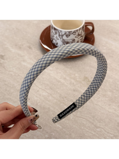 Gifty plaid headband displayed alongside matching minimalist accessories